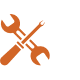 Orange wrench and screwdriver crossed, representing mobile automotive repair services offered by Quick Change Tires.